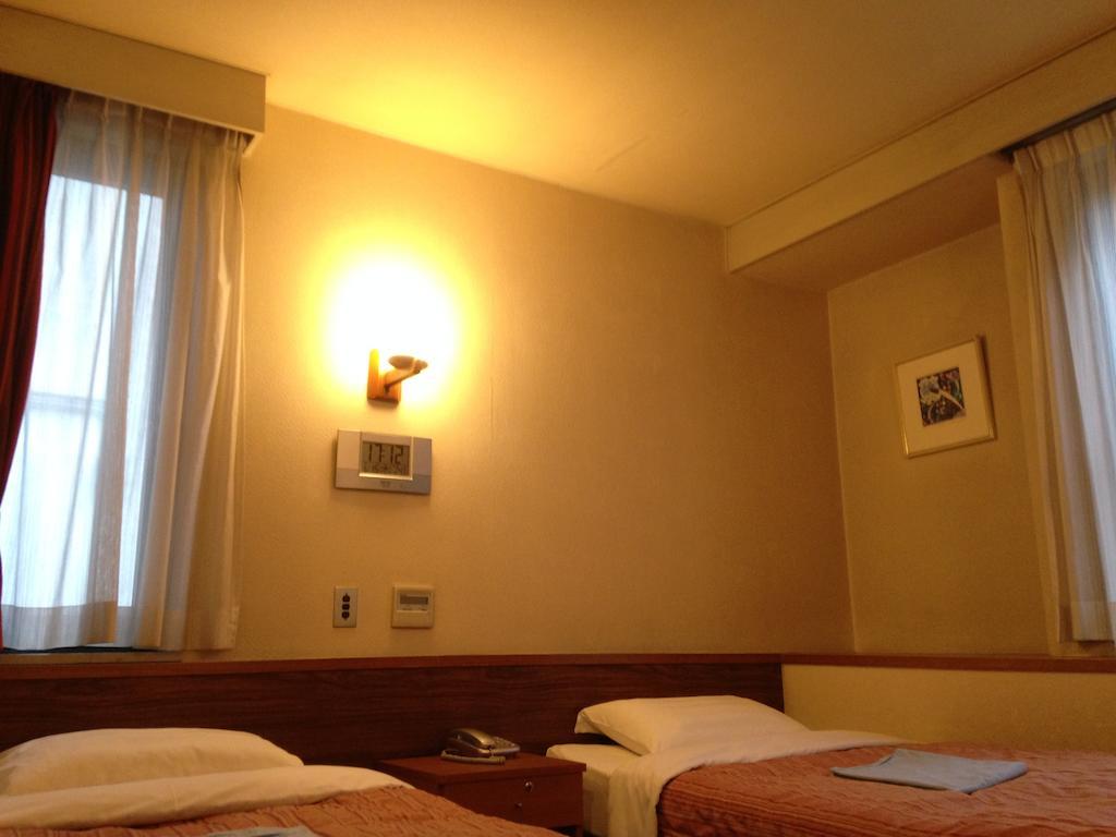 Tourist Hotel Tóquio Quarto foto