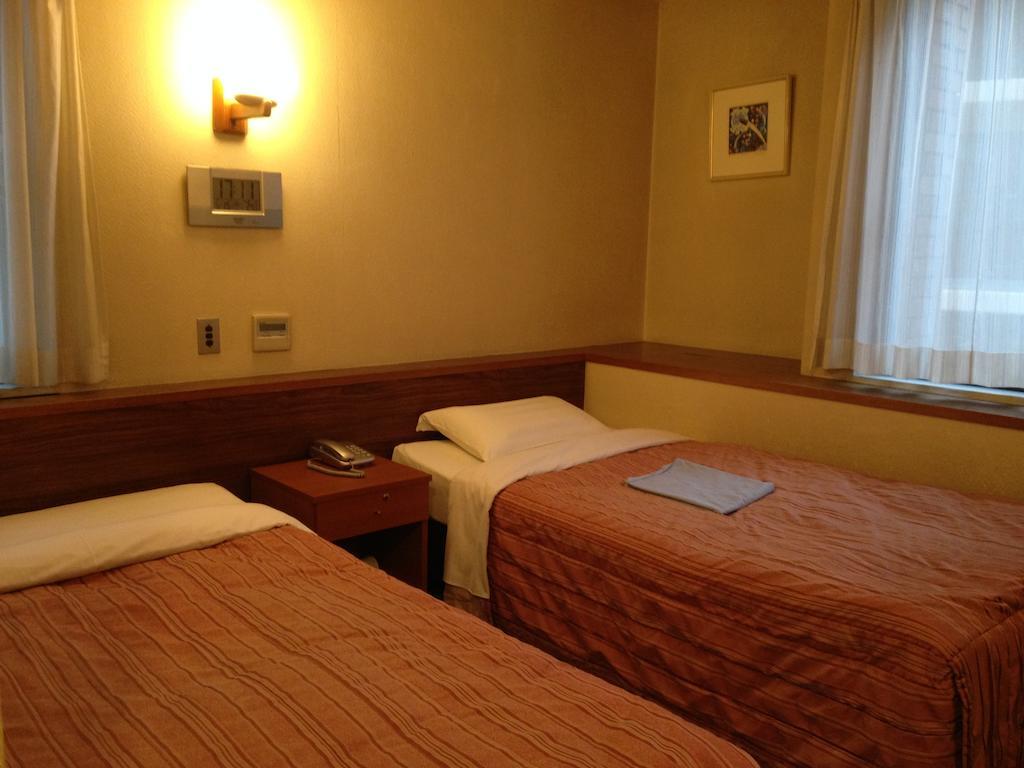 Tourist Hotel Tóquio Quarto foto